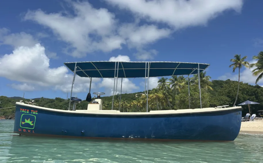 The Taco Tug, a restored 1986 U.S. Navy Motor Whaleboat, cruising the waters off St. Thomas, USVI